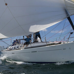 Ian Creak and the crew of Ausreo powering back down the harbour under a very shy symmetrical spinnaker.